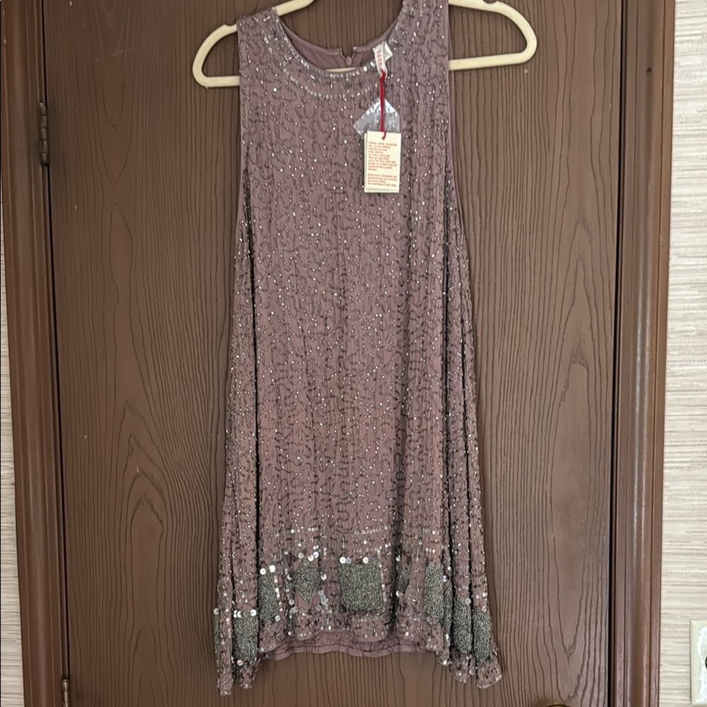 Raga Beaded Sparkling Sleeveless Dress is perfect for any festive gathering.